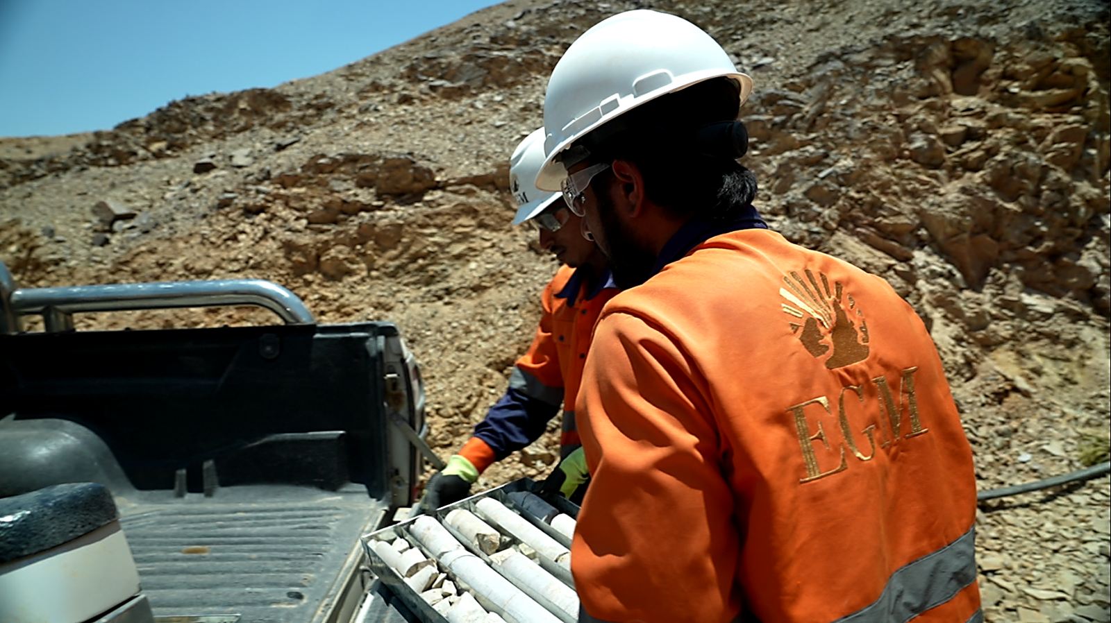 EGM field team handling drill core trays at the drill site